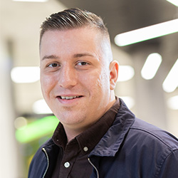 A student smiling at the camera