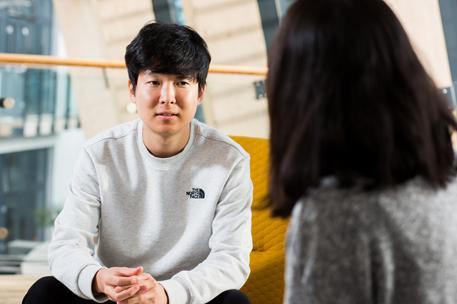 Two students chatting in the Bright Building