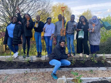 Students posing after plantation in allotment