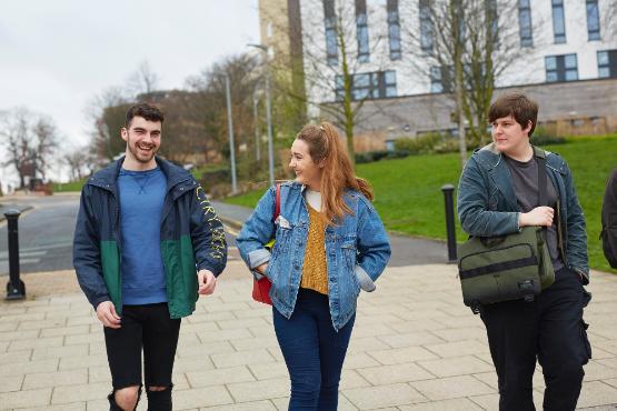 A group of students walking around campus