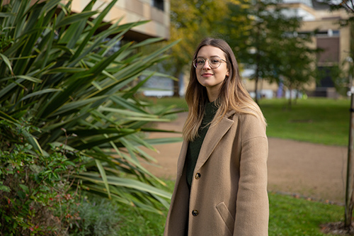 Student on campus smiling