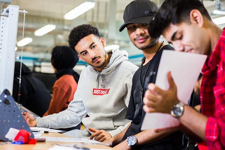 Three Engineering Foundation students working together in class.