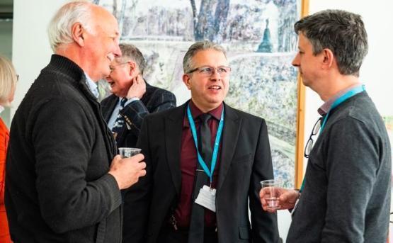 Delegates talking at a networking event