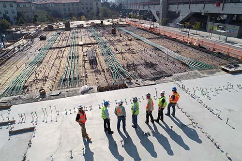 Men standing on a building site 