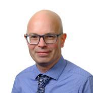 A profile picture of Liam Sutton, Associate Director in Research and Innovation at the University of Bradford