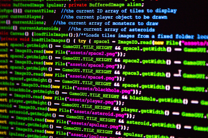 Lines of colourful computer code on a black background.