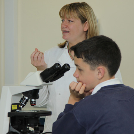 Lecturer teaching a student from year groups 7-9