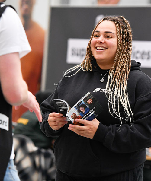 Two students talking at a University of Bradford Open Day.