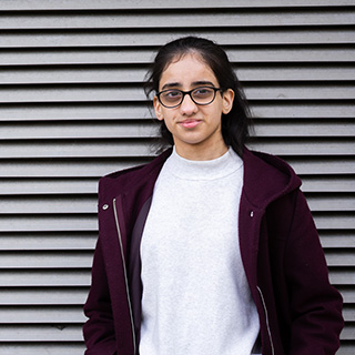 Student smiling at the camera