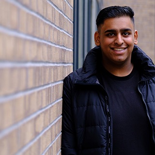 A University of Bradford student sat at a bench.